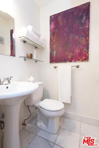 a bathroom with a sink and a toilet