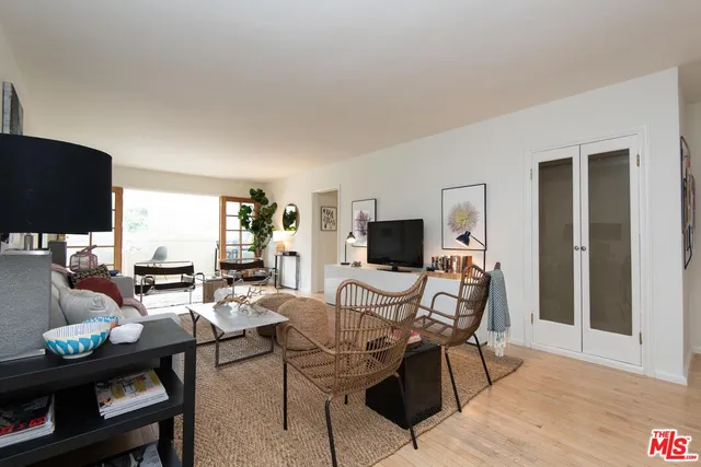 a view of a livingroom with furniture and a flat screen tv