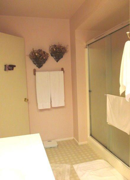 8251 North Applegate Road Grants Pass, OR 97527 - Photo 20 of 35 a bathroom with a sink a mirror and a shower