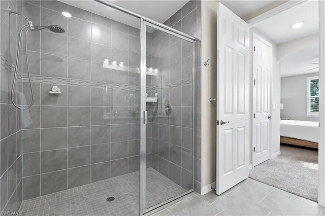 a bathroom with a glass shower door
