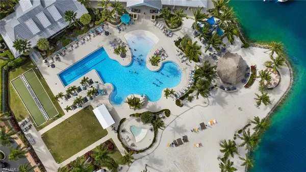 an aerial view of a house swimming pool and garden