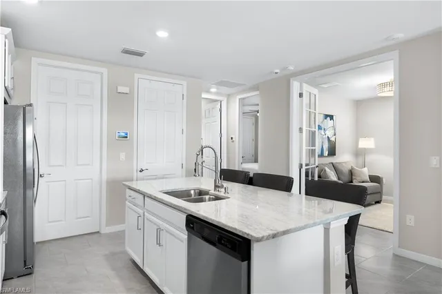 a kitchen with a sink and cabinets