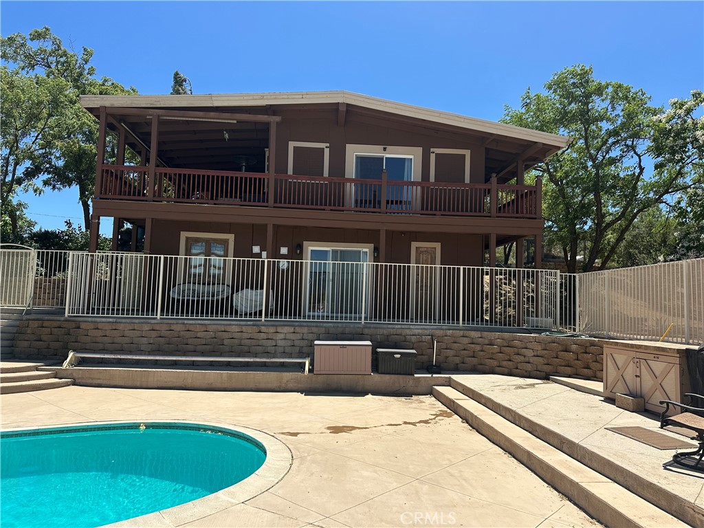 57260 Ramsey Road Anza, CA 92539 - Photo 12 of 46 a view of a house with a wooden deck
