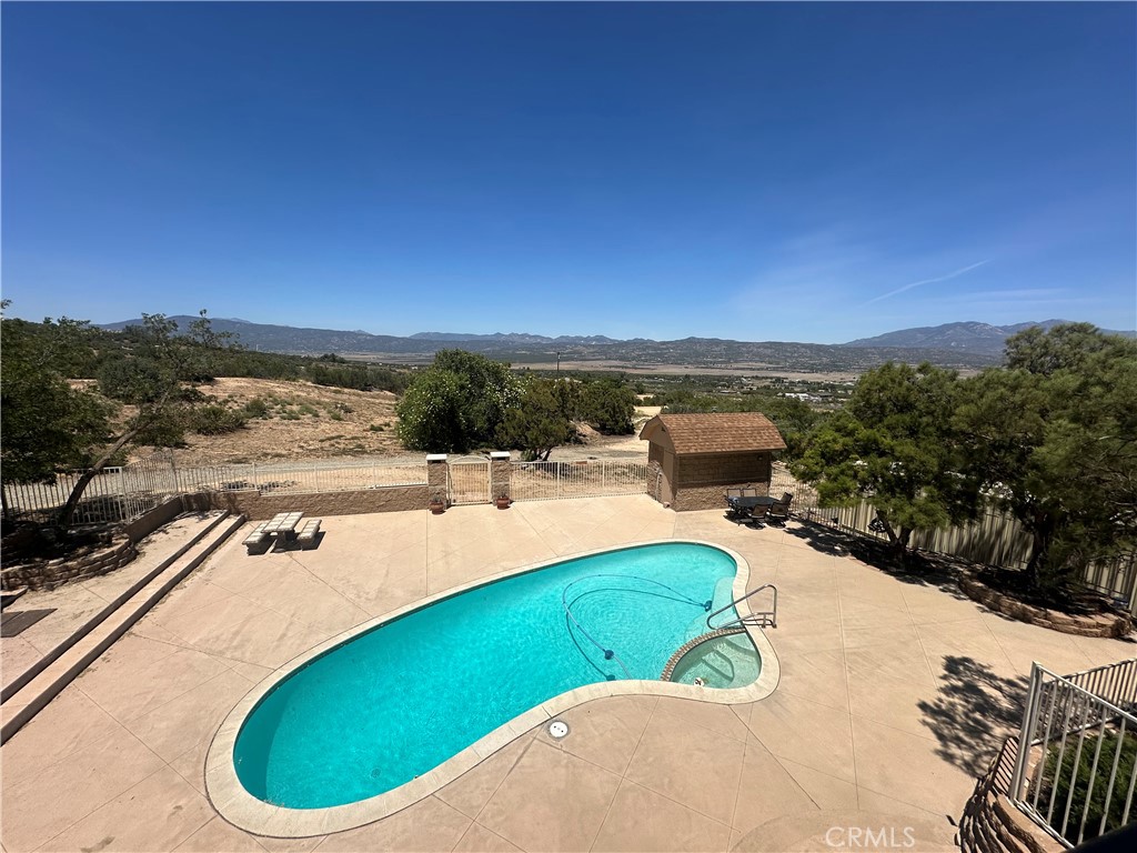 57260 Ramsey Road Anza, CA 92539 - Photo 13 of 46 a view of a swimming pool with a chairs