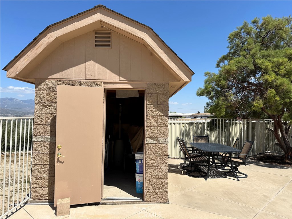 57260 Ramsey Road Anza, CA 92539 - Photo 16 of 46 a front view of a house with a yard