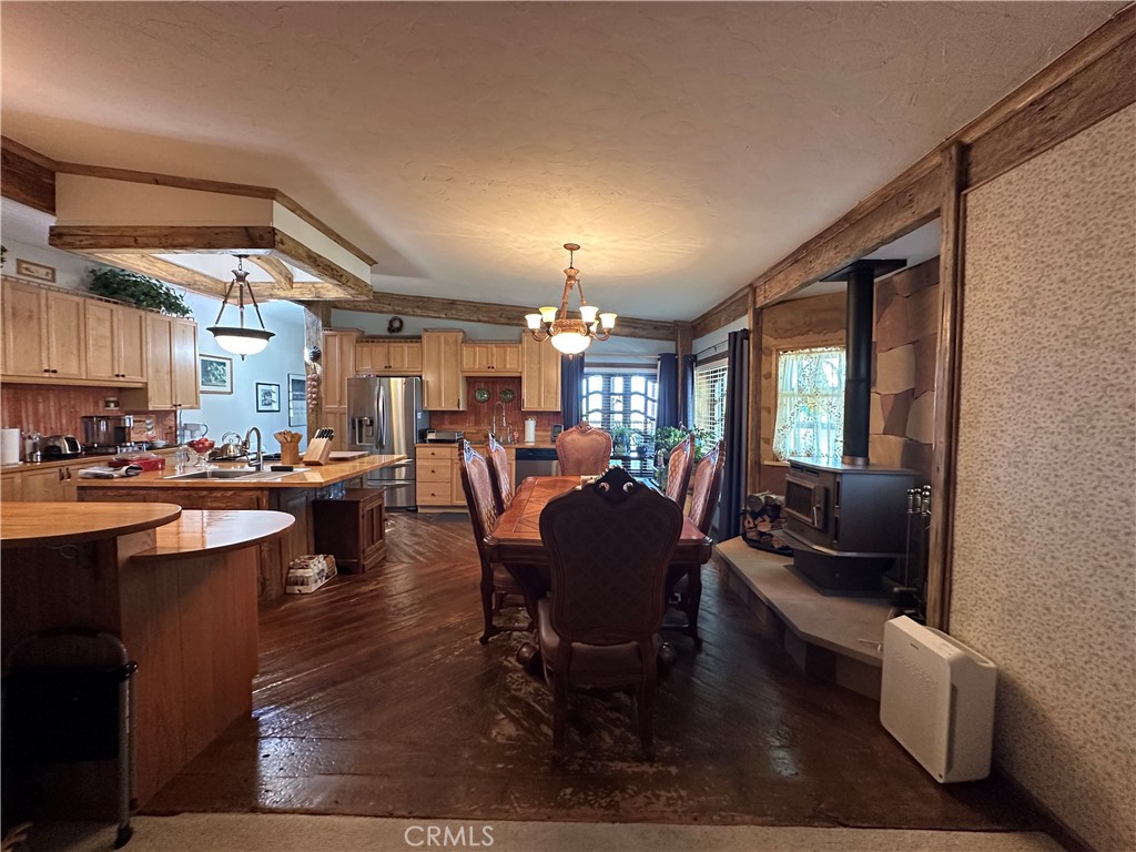 57260 Ramsey Road Anza, CA 92539 - Photo 22 of 46 a living room with lots of furniture and a chandelier