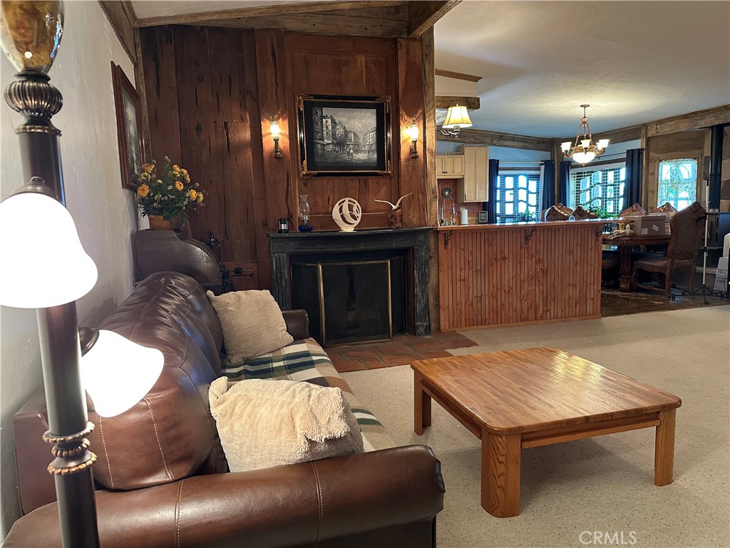 57260 Ramsey Road Anza, CA 92539 - Photo 28 of 46 a living room with furniture and a fireplace