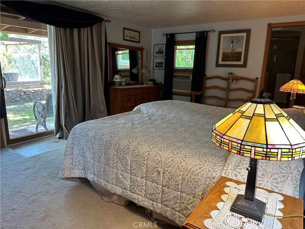 57260 Ramsey Road Anza, CA 92539 - Photo 31 of 46 a bed sitting in a bedroom next to a window