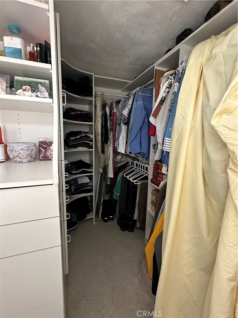 57260 Ramsey Road Anza, CA 92539 - Photo 34 of 46 a view of walk in closet with clothes and shoes
