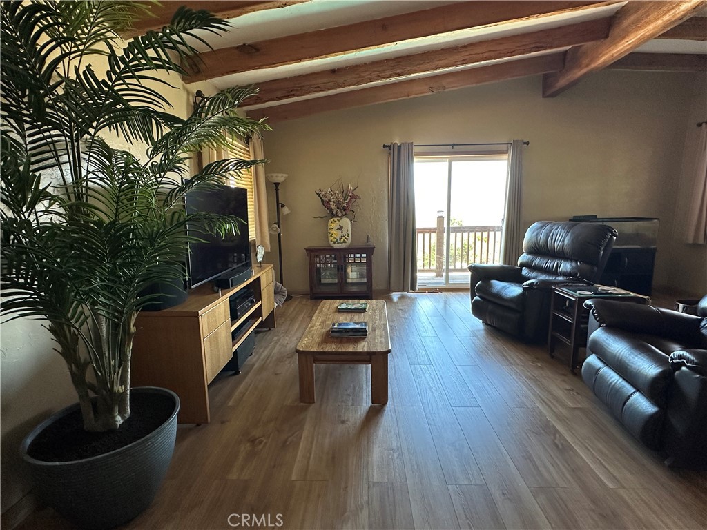 57260 Ramsey Road Anza, CA 92539 - Photo 38 of 46 a living room with furniture and a flat screen tv