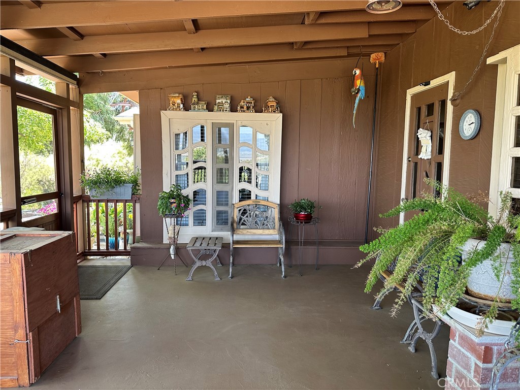 57260 Ramsey Road Anza, CA 92539 - Photo 9 of 46 a balcony with furniture and a potted plant