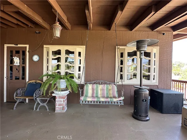 a living room with furniture and windows