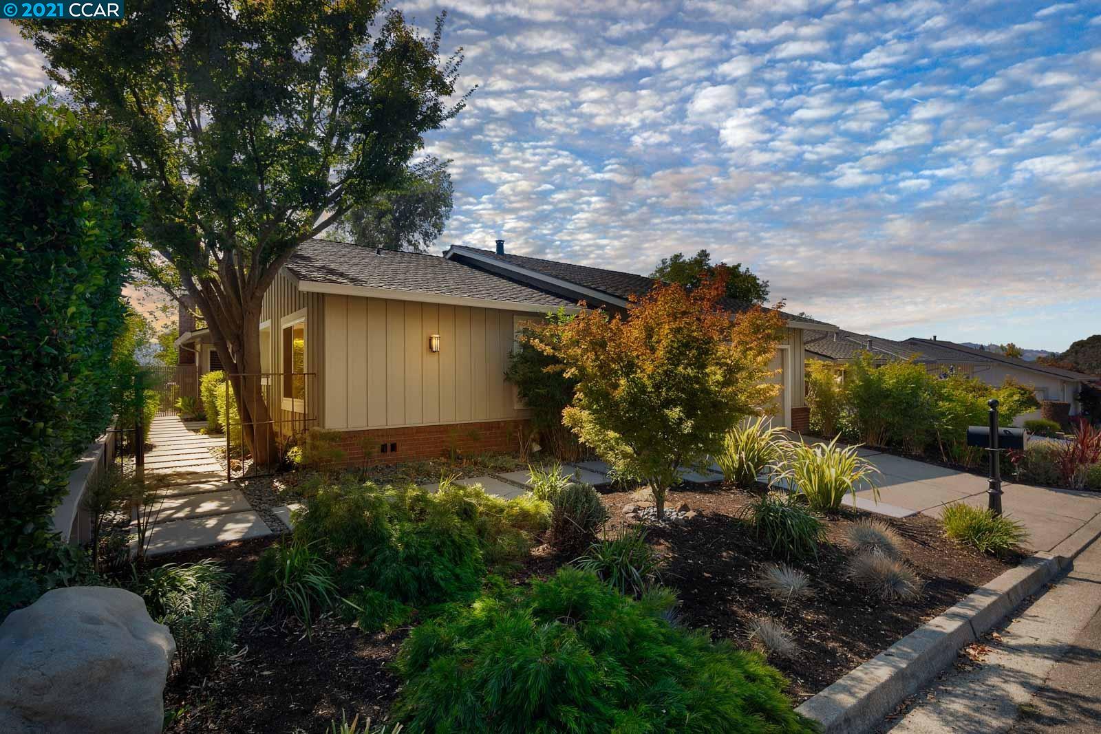 689 St George Road Danville, CA 94526 - Photo 1 of 1 a backyard of a house with lots of plants and trees