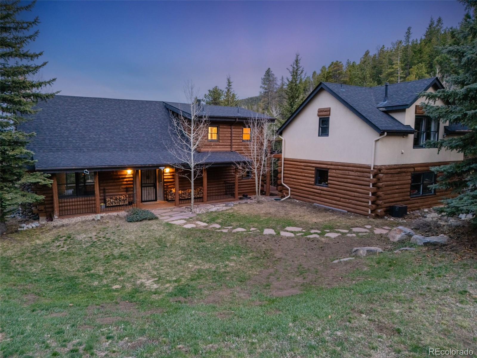 24 Pine Valley Road Evergreen, CO 80439 - Photo 3 of 50 a view of a house with a yard and sitting area