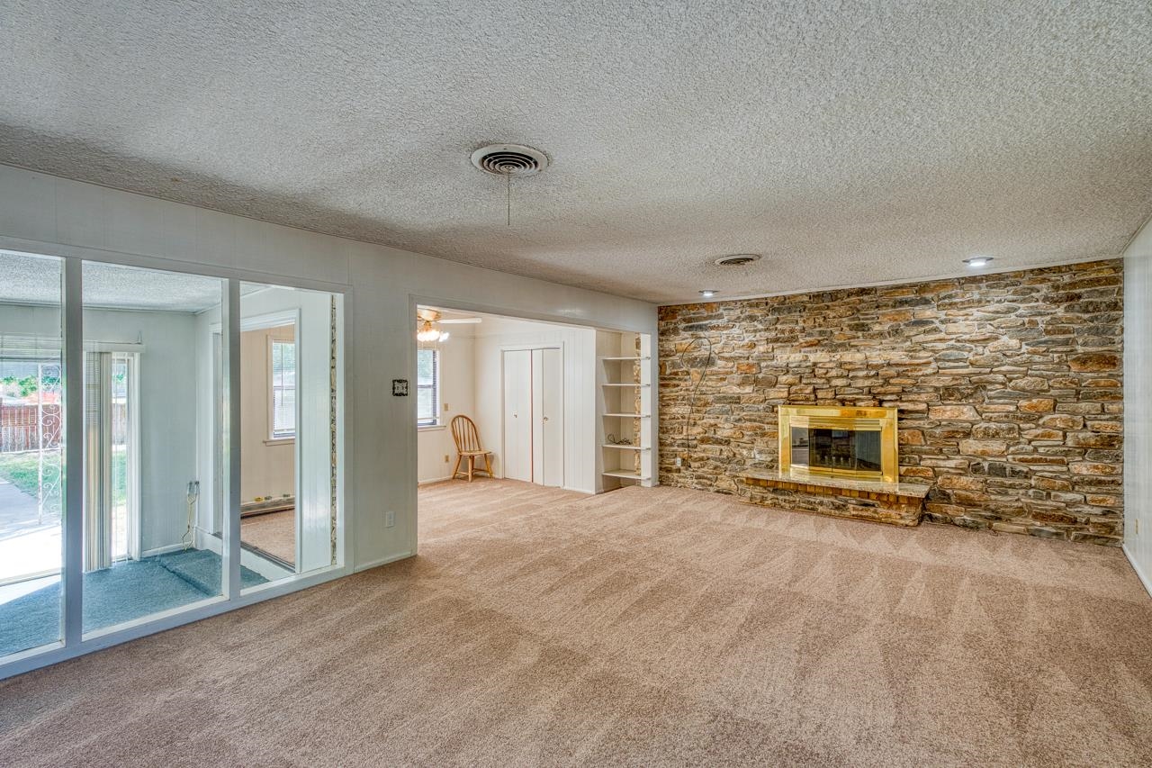 111 Dove Road Highland Haven, TX 78654 - Photo 11 of 19 a view of an empty room with a fireplace
