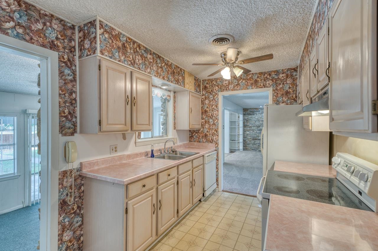 111 Dove Road Highland Haven, TX 78654 - Photo 13 of 19 a bathroom with a sink and a mirror