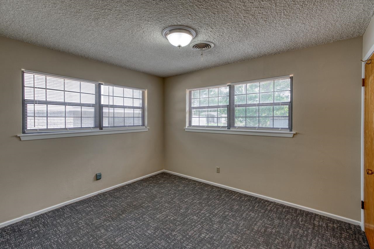 111 Dove Road Highland Haven, TX 78654 - Photo 16 of 19 an empty room with a window