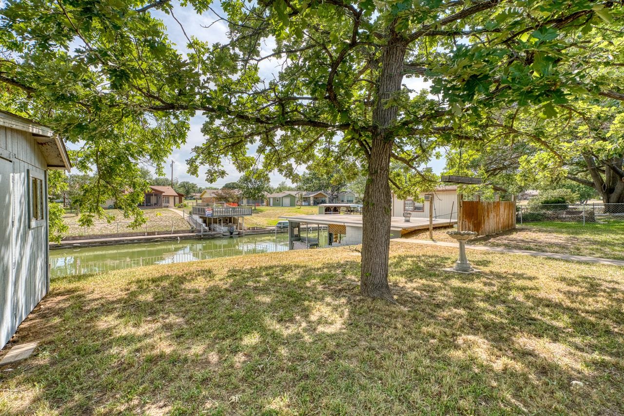 111 Dove Road Highland Haven, TX 78654 - Photo 4 of 19 a view of yard with tree