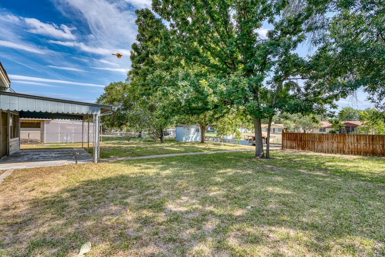 111 Dove Road Highland Haven, TX 78654 - Photo 6 of 19 a view of a house with a yard