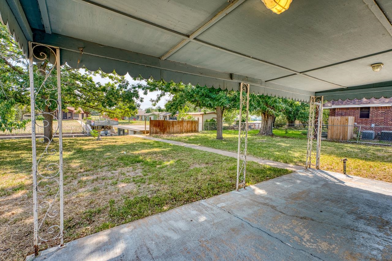 111 Dove Road Highland Haven, TX 78654 - Photo 7 of 19 a view of a house with backyard from a patio