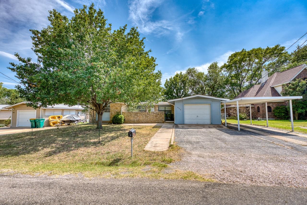 111 Dove Road Highland Haven, TX 78654 - Photo 9 of 19 a view of a house with backyard and sitting area