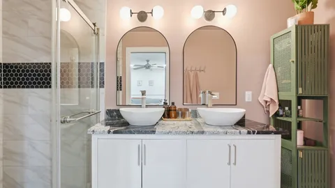 a view of a bathroom with a granite countertop sink and a mirror
