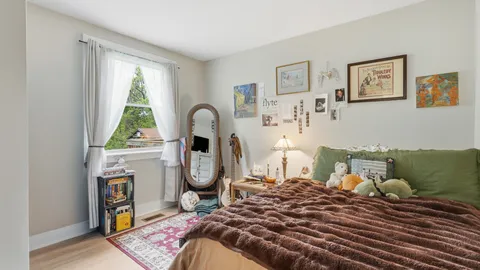 a bed room with a bed and a window