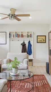 a living room with furniture and a rug
