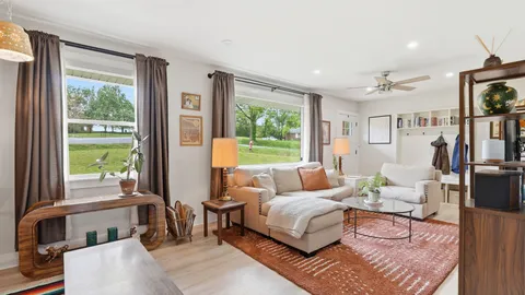 a living room with furniture and a window