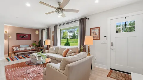a living room with furniture and a window