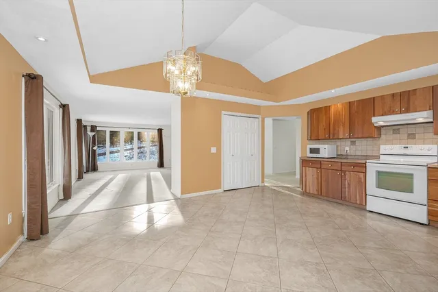 a view of a kitchen with a stove cabinets and a kitchen