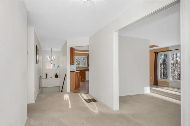 a view of a livingroom with furniture and windows