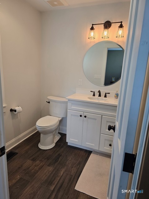 441 David Court Orange, CT 06477 - Photo 20 of 24 a bathroom with a toilet sink and mirror