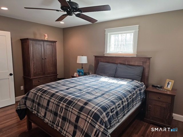 441 David Court Orange, CT 06477 - Photo 21 of 24 a bedroom with a bed and wooden floor