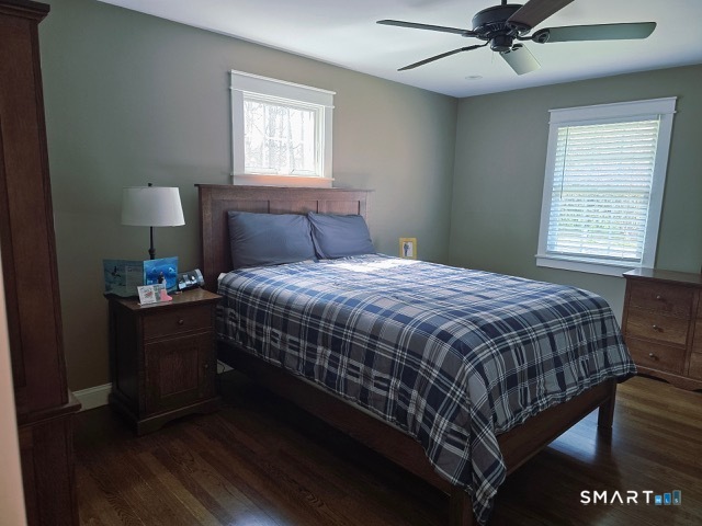 441 David Court Orange, CT 06477 - Photo 22 of 24 a bedroom with a bed wooden floor and window