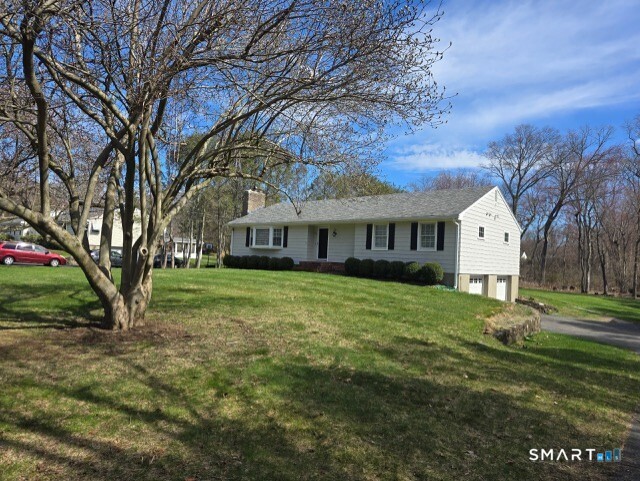 441 David Court Orange, CT 06477 - Photo 3 of 24 a view of a house with a yard