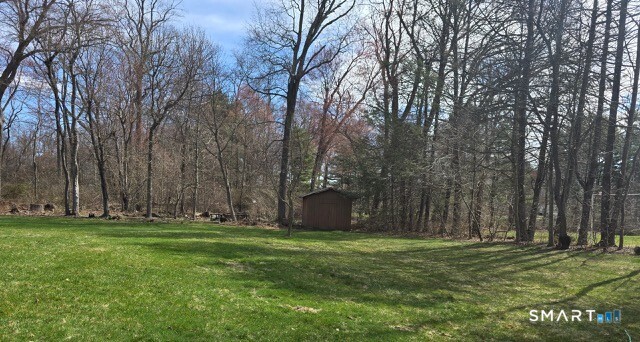 441 David Court Orange, CT 06477 - Photo 4 of 24 a view of a backyard with large trees