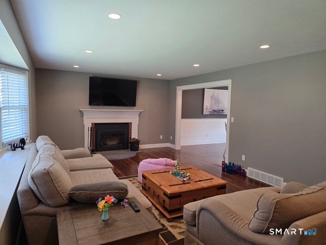 441 David Court Orange, CT 06477 - Photo 7 of 24 a bedroom with furniture and a fireplace