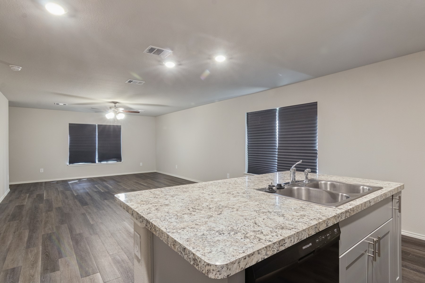 2250 Yelverton Ter Trail Spring, TX 77373 - Photo 10 of 30 a kitchen with granite countertop sink and granite counter tops