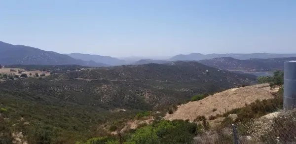 a view of a town with mountains in the background