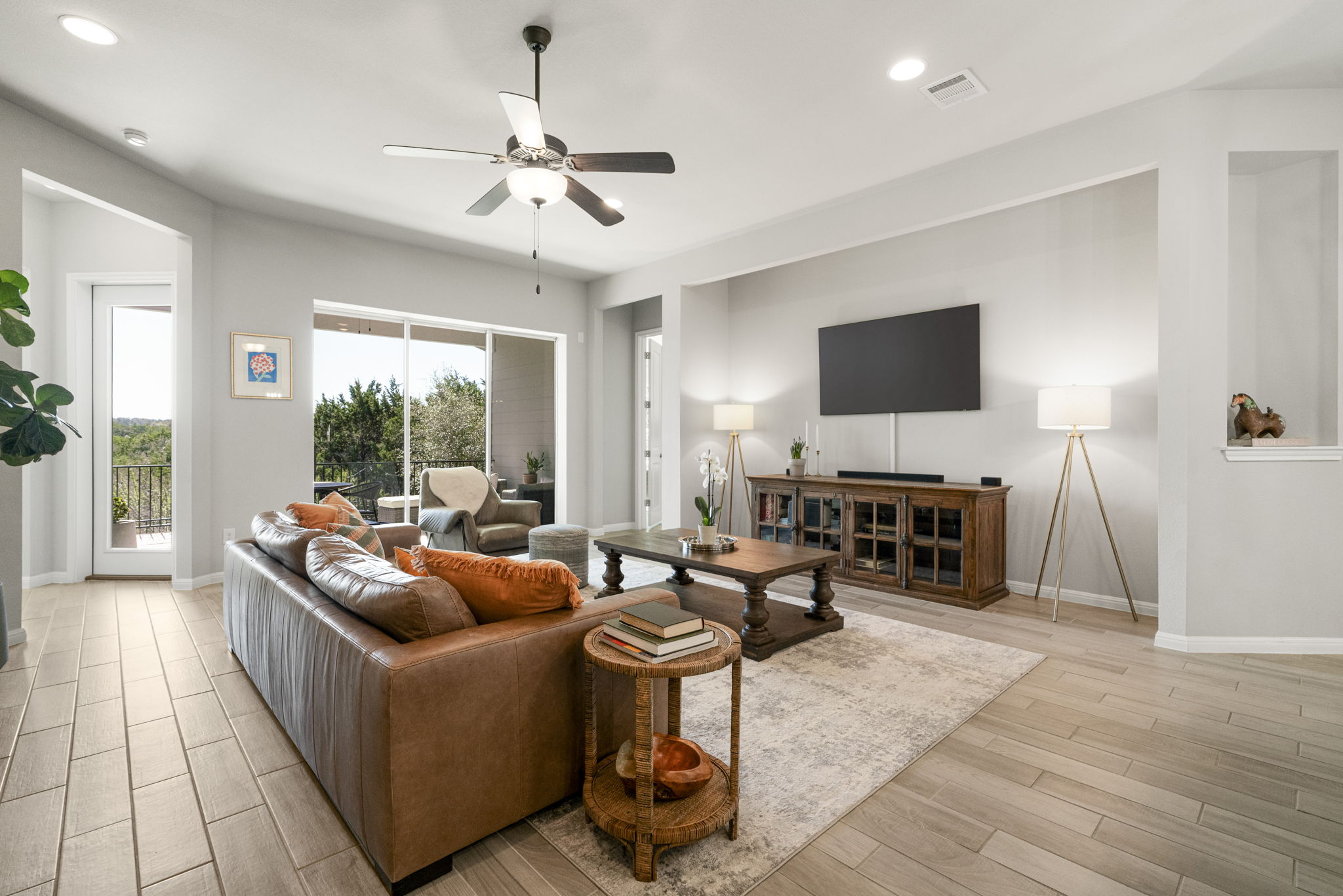 546 Hazy Hills Loop Dripping Springs, TX 78620 - Photo 12 of 40 Large windows frame long-distance Hill Country views and fill the home with soft natural light.