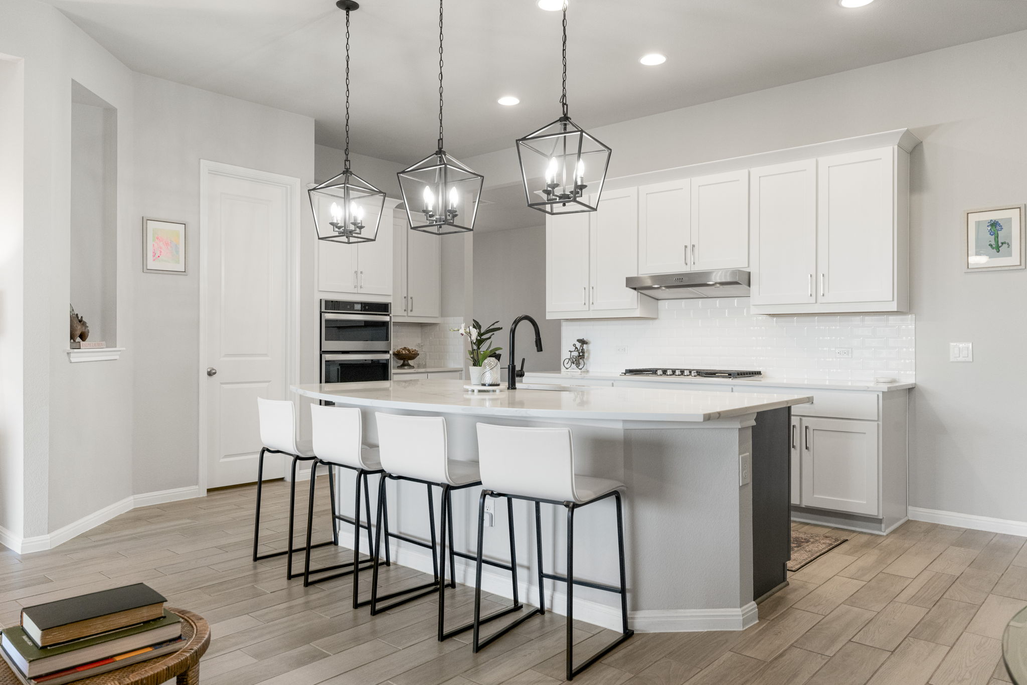 546 Hazy Hills Loop Dripping Springs, TX 78620 - Photo 14 of 40 The bright kitchen features quartz countertops, modern cabinetry, and a large island ideal for casual dining.