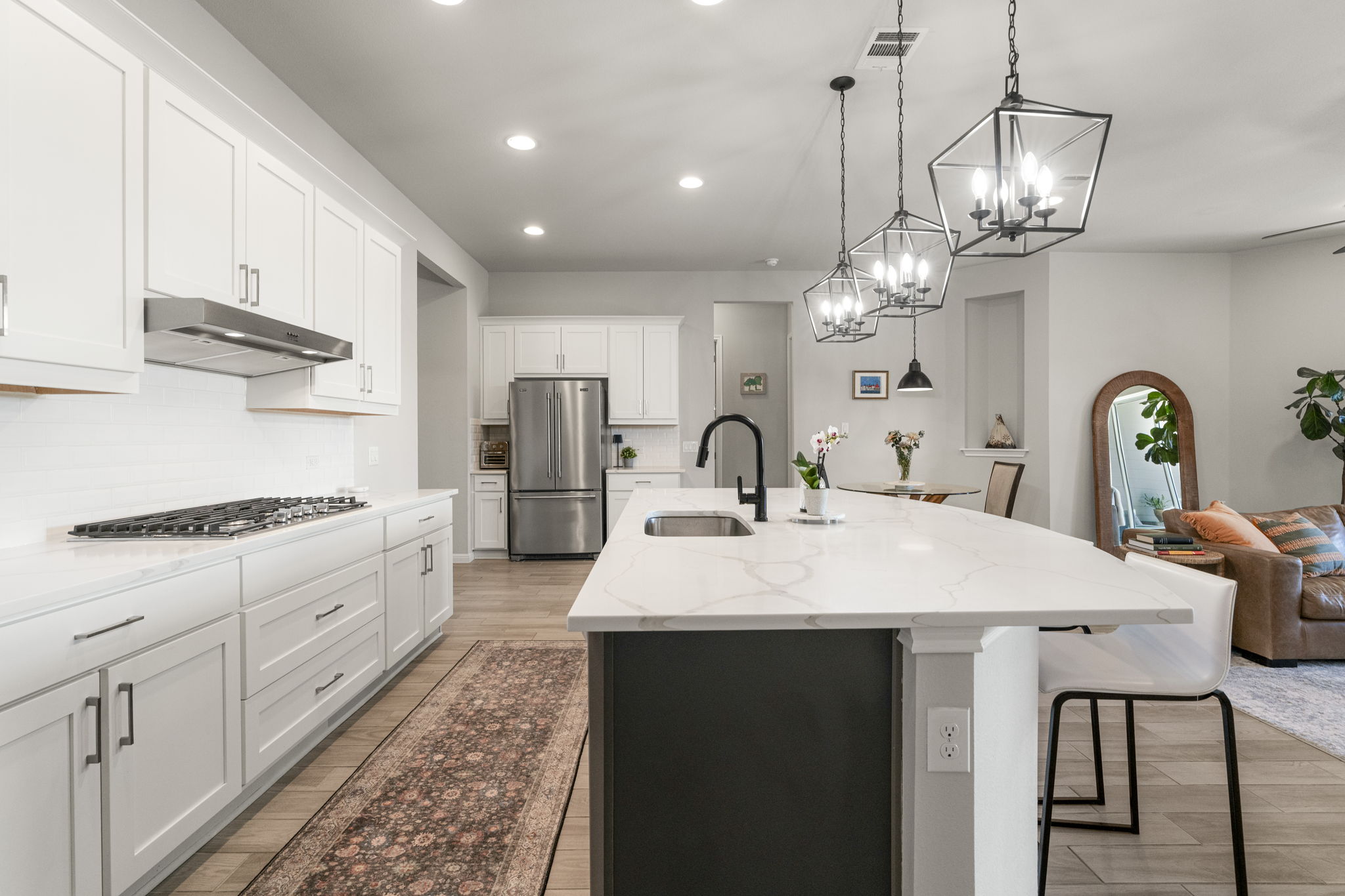546 Hazy Hills Loop Dripping Springs, TX 78620 - Photo 15 of 40 Designed with both style and function in mind, the kitchen provides generous workspace and storage.