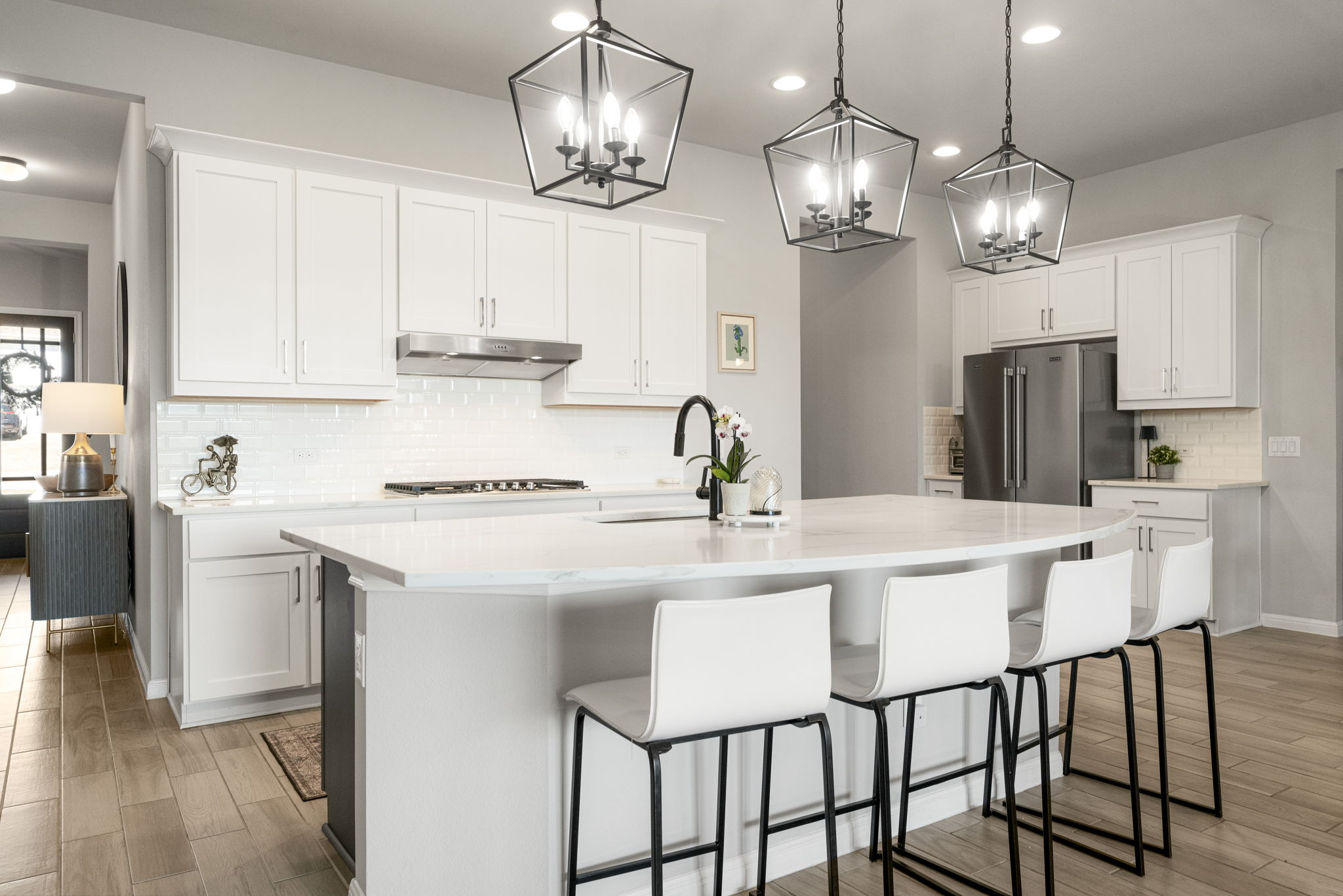 546 Hazy Hills Loop Dripping Springs, TX 78620 - Photo 16 of 40 The open kitchen layout keeps everyone connected while cooking, entertaining, or relaxing at home.