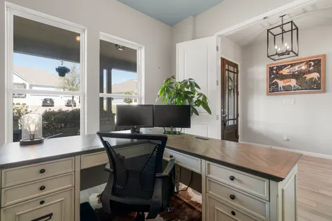 a workspace with furniture and window