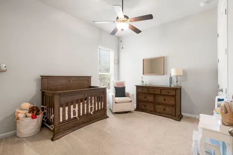 a bedroom with furniture and window
