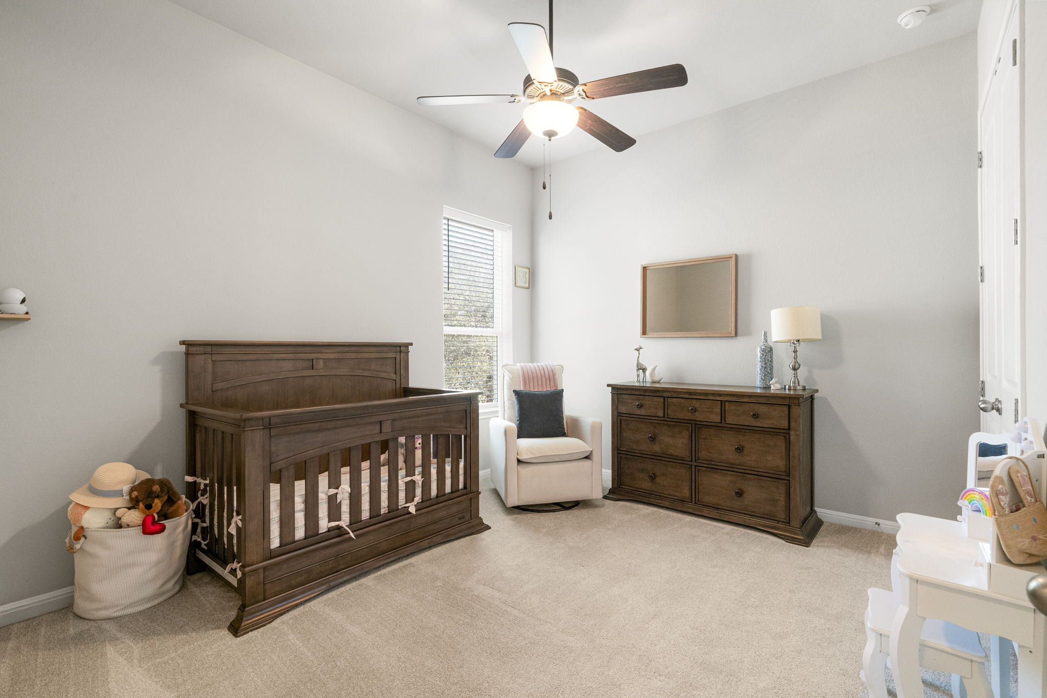 546 Hazy Hills Loop Dripping Springs, TX 78620 - Photo 28 of 40 Another secondary bedroom offers comfortable accommodations with a light and welcoming atmosphere.