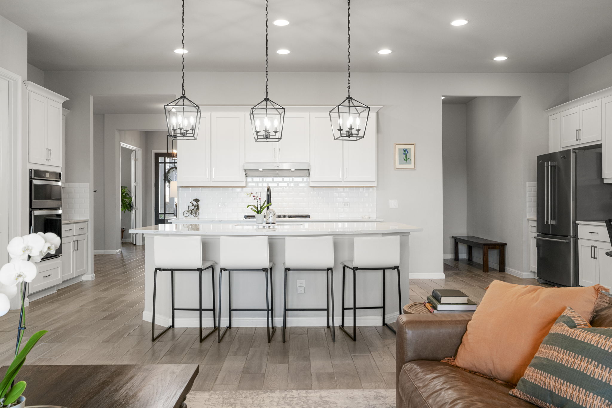 546 Hazy Hills Loop Dripping Springs, TX 78620 - Photo 5 of 40 The gorgeous open-concept kitchen features a large center island and seamless connection to the living spaces.