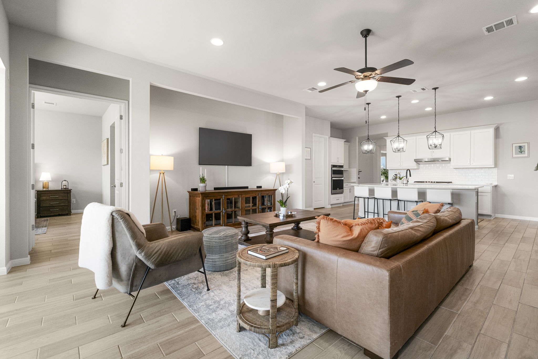 546 Hazy Hills Loop Dripping Springs, TX 78620 - Photo 10 of 40 The main living area serves as a comfortable gathering space with easy access to the kitchen and dining areas.