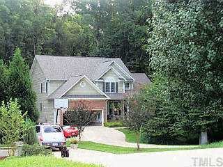 2908 Dunkirk Drive Raleigh, NC 27613 - Photo 1 of 1 a aerial view of a house with a yard potted plants and large tree